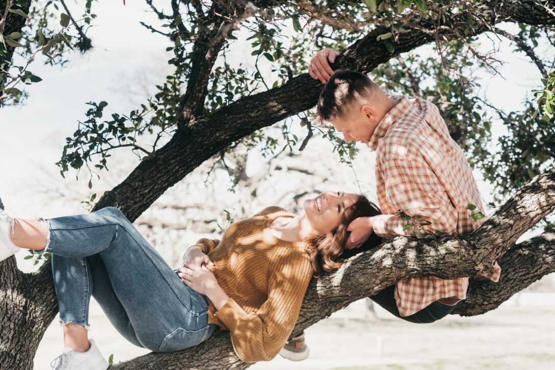 Man and woman in tree smiling