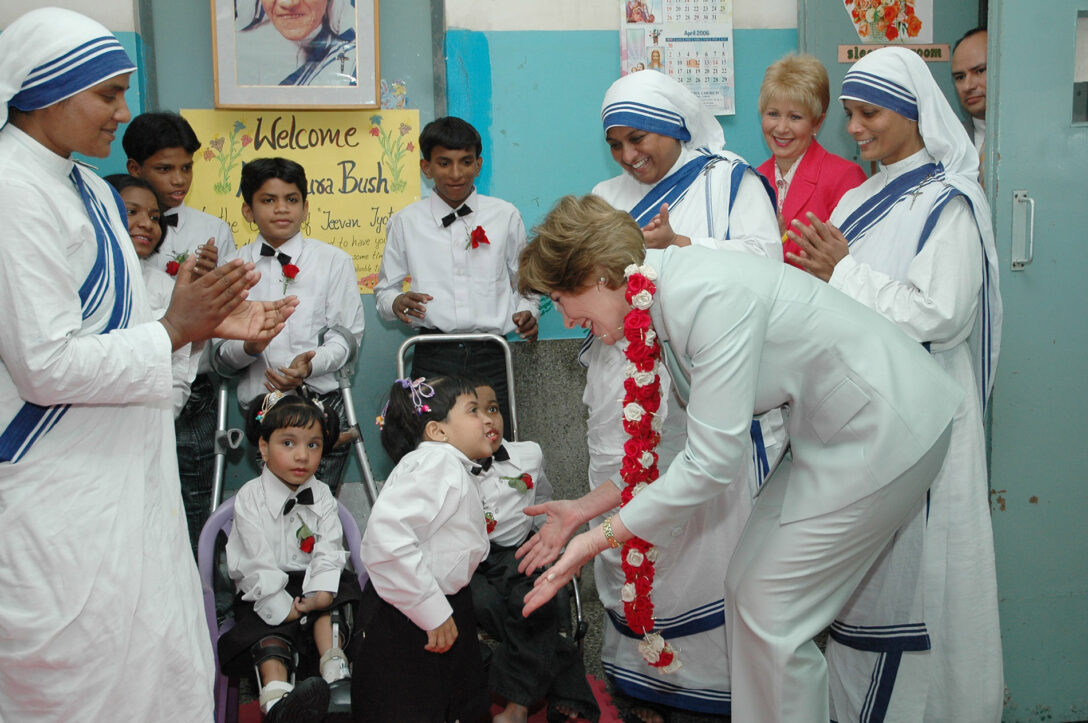 Missionaries of Charity and children are visited by Laura Bush in New Delhi.